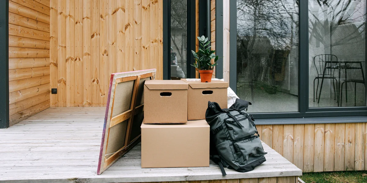 Packed moving boxes and household belongings ready for the next step